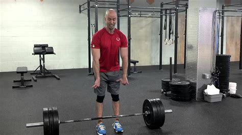 Paused deadlift - PAUSE DEADLIFT This is a modification to the CONVENTIONAL DEADLIFT that uses a pause to increase time under tension and for developing bottom-end strength. Start with your feet roughly hip distance apart and hands gripping the bar shoulder distance apart.